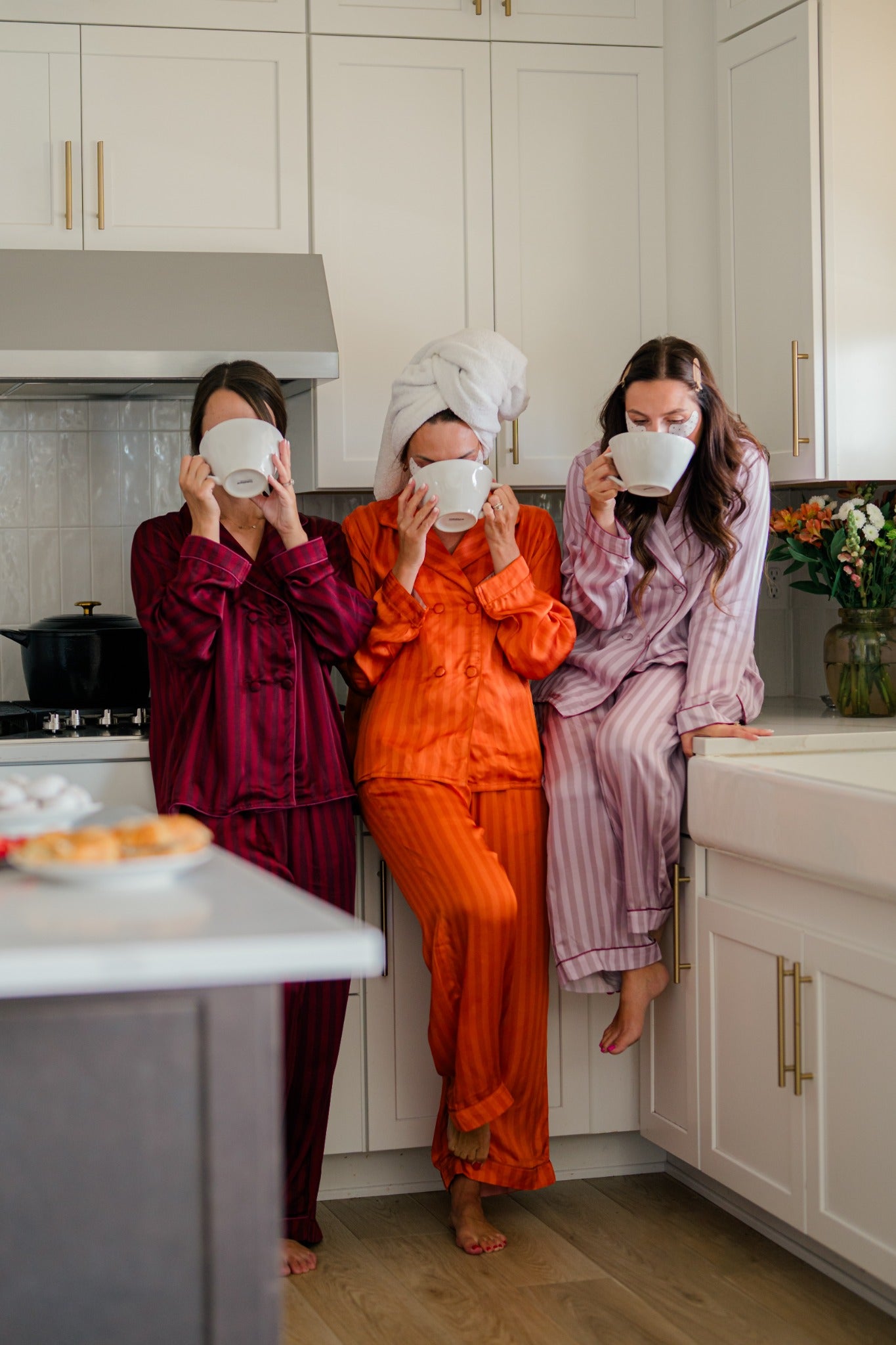 Friends sharing coffee in Market Wife sleepwear